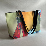 Studio front view of "Ashlie + Archer" large canvas tote bag, used as a reusable beach bag tote, everyday carryall, or cute tote bag for women. If you like Free People tote bags, then you’ll love this stylish weekender.