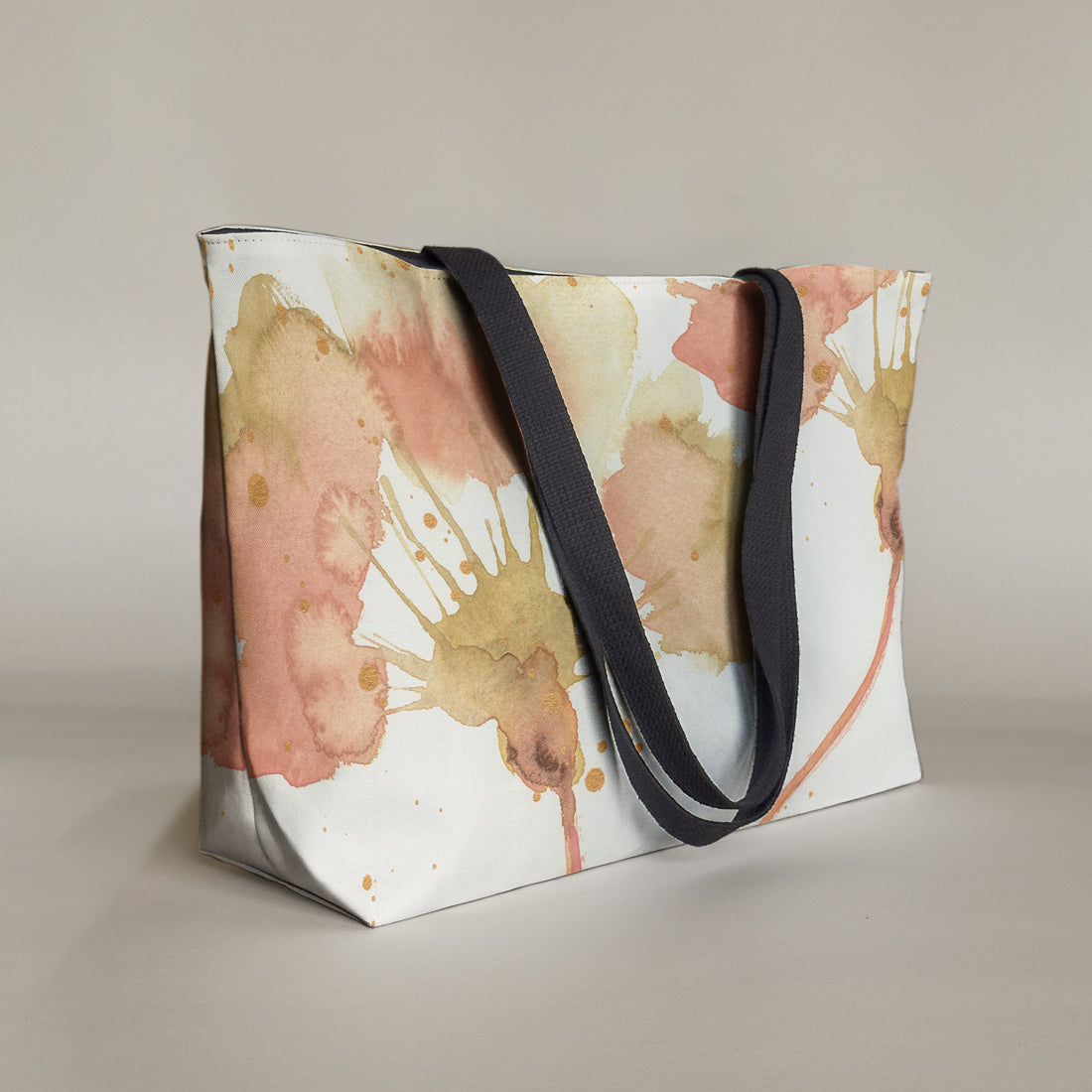 Studio front view of a large canvas tote bag, used as a reusable beach bag tote, everyday carryall, or cute tote bag for women. If you like Free People tote bags, then you’ll love this stylish weekender.