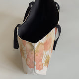 Studio open view of a large canvas tote bag, used as a reusable beach bag tote, everyday carryall, or cute tote bag for women. If you like Free People tote bags, then you’ll love this stylish weekender.