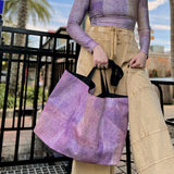 Women at cafe with the "Sunset" large canvas tote bag, used as a reusable beach bag tote, everyday carryall, or cute tote bag for women. If you like Free People tote bags, then you’ll love this stylish weekender.