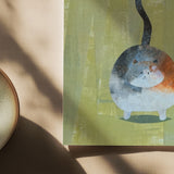 Close up view of a 6×6 blank collage note card “Happy Cat” with kraft envelope on tabletop—perfect for cat lovers, blank thank you cards, calico cat cards, baby shower thank you cards, graduation thank you cards, wedding note.