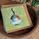 Set of cards in a bowl of a 6×6 blank collage note card “Happy Cat” with kraft envelope on tabletop—perfect for cat lovers, blank thank you cards, calico cat cards, baby shower thank you cards, graduation thank you cards, wedding note.