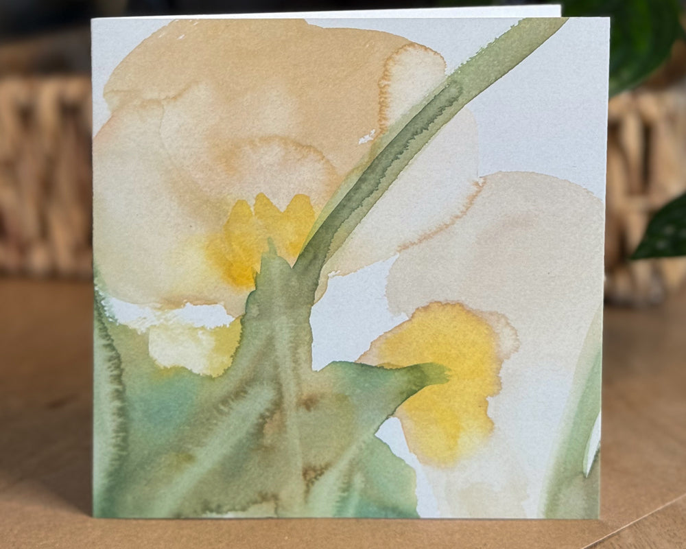 Portrait view of a 6×6 blank watercolor note card “Gentle Anemones” propped on a kraft envelope against a natural tabletop—perfect blank thank you cards, baby shower thank you cards, graduation thank you cards, wedding note.