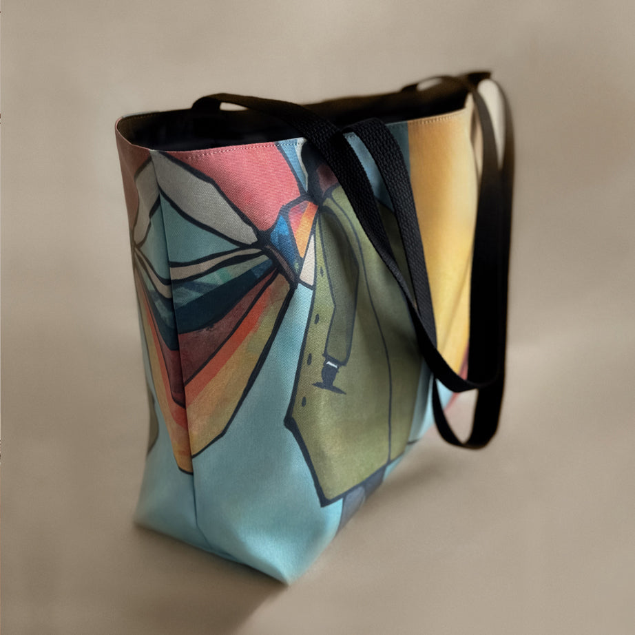 Side view of a tote and carry Weekender Tote with Ashlie + Archer design by GraylingHome.com, featuring a colorful abstract art print and black straps; canvas-feel tote bag for everyday use, cute tote bag, great gift idea for women or men