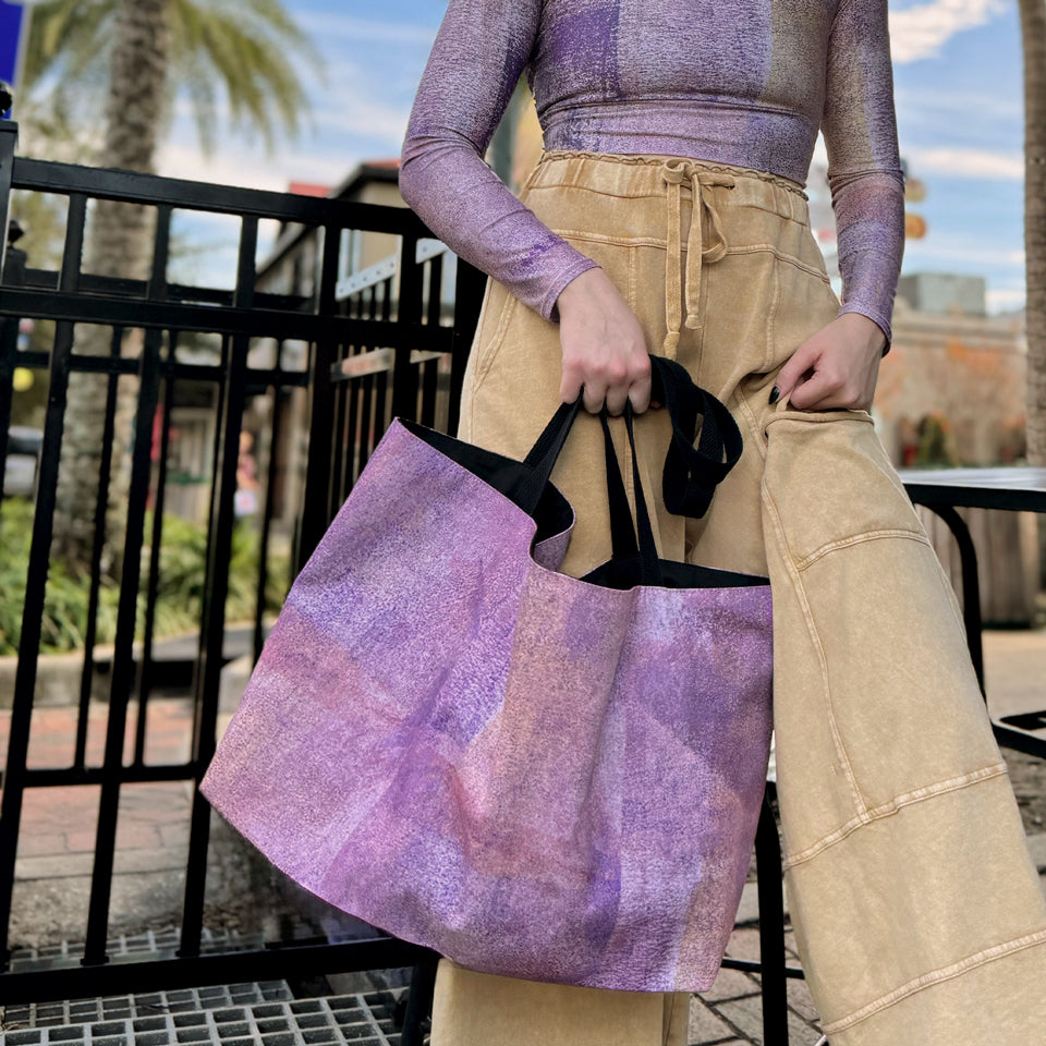 Women at cafe with the "Sunset" large canvas tote bag, used as a reusable beach bag tote, everyday carryall, or cute tote bag for women. If you like Free People tote bags, then you’ll love this stylish weekender.